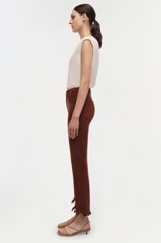 PRE-FALL 2024 WOMEN'S COLLECTION The River Jeans in Anise. Crafted from high-quality denim, these jeans feature a flattering high waist and a slim fit that extends to a stylishly cropped hem. The rich brown color adds a sophisticated and contemporary twist to a classic design. Functional pockets and durable construction ensure both practicality and style. January Jones, Swim Gifts, Knitwear Tops, Shop Swimwear, Fall 2024, Pre Fall, British Indian, The River, Cropped Jeans