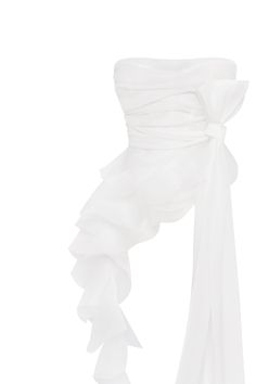 Charming blouse made from soft organza in a white color. The gathered bodice defines the waist, and detachable off-the-shoulder sleeves adorned with ethereal ruffles add a touch of romance to the look. Details: Material: Organza Fabric composition: 100% Polyester Sleeve style: Detachable off-the-shoulder Neckline: Straight Back: Open with a bow Model is: 173 cm / 80-60-92, wearing size S Art.N.: 2402-20 White White Off-shoulder Party Blouse, Chiffon Ruffle Blouse For Wedding, White Organza Party Blouse, White One-shoulder Party Blouse, White Organza Blouse For Party, White Silk Blouse With Ruffles, Formal Organza Blouse With Ruffles, White Organza Blouse For Evening, Elegant White Off-shoulder Blouse