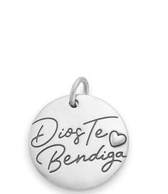 From James Avery&#x2C; this charm features:This sterling silver charm from James Avery carries the meaningful phrase&#x2C; Dios Te Bendiga&#x2C; which means God bless you in Spanish. The heart helps to emphasize the love behind the phrase.Sterling silverApprox. 0.6875" diameterCrafted in America using the world's finest materials.Due to the personalized nature of James Avery bracelets&#x2C; we are unable to attach charms and customize y Charms James Avery, Inspirational Silver Jewelry With Customizable Engraving, Inspirational Silver Jewelry With Engraving Option, Engraved Sterling Silver Round Pendant Charms, Personalized White Gold Charms For Mother's Day, Personalized White Gold Sterling Silver Charms, Personalized White Gold Round Pendant Charm, Personalized Round Sterling Silver Charms, Personalized Inspirational Silver Charm Necklace