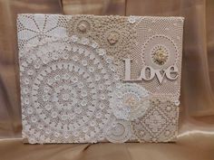 a white card with lace on it and the word love written in large letters,