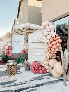 an outdoor display with balloons and other decorations