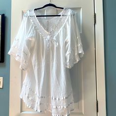 Beautiful, Flowy 100% Cotton Blouse With Ribbon Detailing Made In India. No Tags, But Never Worn. Just In Time For Summer Flowy White Top For Beach Cover-up, Cotton V-neck Blouse For Vacation, Cotton V-neck Peasant Top For Vacation, Casual V-neck Tunic For Brunch, Flowy V-neck Tops For Beach Cover-up, Spring Beach Cover-up Tops With Lace Trim, Beach Peasant Top With Relaxed Fit, White Flowy Top For Beach Cover-up, V-neck Beach Cover-up Tops