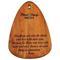 a wooden plaque with a quote on it