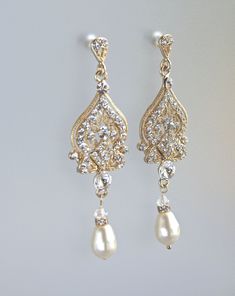 "The latest addition to our 'Lucy' range is the gold version of our popular earring which has such an elegant and classy style. They have a super pop of sparkle whilst still fitting the 'vintage' theme. They will flatter your face no matter the shape of your jawline and ooze elegance and class. Every step you take makes them shimmer, and are very 'wedding photograph' worthy. Measurements: Length - 2.5\" ★Customise your earrings and choose your pearl color from the drop menu. Set in tarnish resis Classic Gold Diamond Earrings With Elegant Design, Classic Gold Chandelier Earrings For Anniversary, Ornate Gold Diamond Earrings For Formal Events, Ornate Gold Diamond Earrings For Formal Occasions, Intricate Design Diamond Dangle Earrings For Wedding, Elegant Yellow Gold Teardrop Earrings For Wedding, Classic Gold Teardrop Bridal Earrings, Classic Bridal Earrings For Wedding, Classic Gold Bridal Earrings