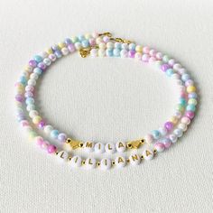 This pastel mermaid necklace is strung on very sturdy wire with iridescent faux pearl beads with your child's name spelled out in gold letter beads accentuated with 18K gold hearts or 18K gold ball beads.  If you need a gift for your daughter, girls birthday gift, granddaughter gift, friends daughter, Niece Gift, or Easter Gift, this beautiful necklace is the right choice!  It is an adorable personalized gift that will surely bring smiles.  Choose which style you would like from the drop down me Cheap Letter Beads Necklace For Birthday, Cheap Letter Beads Necklace For Birthday Gift, Cheap Customizable Beaded Necklaces For Gifts, Cheap Personalized Beaded Necklaces As Gifts, Kids Pearl Necklace Children, Cheap Personalized Beaded Necklaces For Gifts, Cheap Personalized Beaded Necklace For Gift, Fall Necklaces For Kids, Preschool Name Necklace