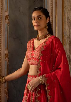 Editor's Note Introducing an exquisite cherry red floral and border printed hand-embroidered cotton silk lehenga set, paired with a print highlighted blouse and a net embroidered dupatta. Crafted from our signature print, this ensemble exudes elegance and charm. The intricate hand embroidery adds a touch of opulence and sophistication. Step into any special occasion with confidence, adorned in this captivating cherry red lehenga set that effortlessly combines traditional craftsmanship with conte Rani Lehenga, Blouse Yoke, Floral Lehenga, 1950’s Fashion, Resort Look, Dress And Jacket Set, Drape Saree, Red Lehenga, Embroidered Dupatta