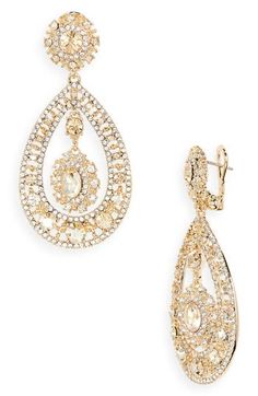 Goldtone filigree teardrop earrings encrusted with pavé crystals evoke opulent glamour. 2 1/2" drop; 1 1/8" width Metal/glass Imported Teardrop Chandelier Earrings With Diamond Accents For Formal Occasions, Formal Teardrop Chandelier Earrings With Diamond Accents, Glamorous Chandelier Drop Earrings With Sparkling Stones, Evening Chandelier Drop Earrings With Diamond Accents, Diamond Accents Teardrop Earrings For Evening, Glamorous Formal Jewelry With Intricate Design, Glamorous Sparkling Teardrop Chandelier Earrings, Glamorous Teardrop Earrings With Sparkling Stones, Dazzling Teardrop Chandelier Earrings For Evening