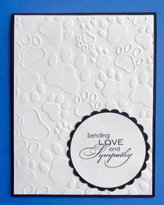 a white card with black and white writing on it that says sending love and sympathy