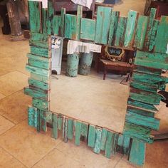 there is a mirror made out of wood blocks