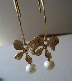 these simply elegant earrings feature lustrous round pearls dangle from orchid flower component. vermeil long earwires. 2.1''long.Looking for silver version of the earrings~http://www.etsy.com/listing/56579374/pearl-silver-orchid-earrings-bridalPlease convo me if you would like to customize this piece or order multiples for your bridal party , I would love to hear from you! Elegant Yellow Gold Flower Pearl Earrings, Elegant Yellow Gold Flower-shaped Pearl Earrings, Elegant Gold Flower Shaped Pearl Earrings, Elegant Gold Flower Pearl Earrings, Elegant Gold Flower-shaped Pearl Earrings, Elegant Flower Earrings With Lever Back For Anniversary, Elegant Floral Earrings With French Hook, Elegant Flower Shaped Earrings With French Hook, Dainty Gold Flower-shaped Pearl Earrings