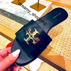 Brand New In Box Tory Burch Black Everly Slide Sandals Calf Leather With Shiny Full Iconic Brand Gold Logo Discontinued And Hard To Find Leather Upper And Lining Rubber Sole Shiny Gold Full Logo Made In Vietnam Please Note: Dust Bag Is Not Included. 100% Authenticity Guaranteed. All Of Our Brand New Items Are Purchased From The Brand/Boutique/Company Store Directly. Due To Income Tax And Authenticity Purposes We Have Original Store Receipt For Every Item We Sell. Please Feel Free To Email Any Qu Chic Tan Flat Heel Sandals, Miller Sandal, Tory Burch Miller, Income Tax, Blue Sandals, Tory Burch Miller Sandal, Boutique Brands, Gold Logo, Sandals Black