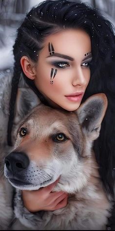 a woman with black makeup holding a wolf