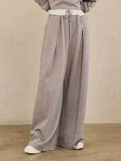 These Double Waist Wide Pants are designed for a modern and sophisticated look, combining aesthetics with practicality.- A contrast band in cotton material for a stylish touch- Offers a relaxed fit with pleats for comfort and ease of movement- Can be styled as a set with a cropped T-shirt* Threads and wrinkles that occur during the production process, as well as chalk marks, are not considered defects.* Actual product color may vary according to the monitor resolution. Pants For Fall 2024, Classic Loungewear Trousers, Modern Trousers For Loungewear, Chic Gray Cotton Bottoms, Cotton Wide Leg Pants For Daywear, Classic Wide-leg Loungewear Pants, Cotton Wide Leg Pants For Daywear In Fall, Cotton Wide Leg Pants For Fall Daywear, Classic Wide-leg Pants For Loungewear