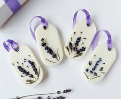 four soaps decorated with lavender flowers and ribbons