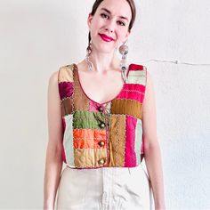 Handmade Antique Crazy Quilt Cropped Vest - Red, Brown, Orange, Green, And Gold Silk Patchwork - Hand Embroidery In A Zig Zag Pattern - Brass Buttons - Boxy Style - Cropped Style - Lined With Silk Printed Fabric - Made From An Antique Textile From The 1800s - Contrasting Piping Please Refer To The Measurements Carefully, As Returns Are Not Accepted: Modern Day Size Large Pit To Pit: 19.5” Waist: 20” Length: 16” (Model Is 5’8”) *All Measurements Are Taken Flat* Worn Oversized On A Model Who Normally Wears A Size Small Condition: Stunning! Considering The Age Of The Textile (It’s Over 100 Years Old), It Is In Great Condition. One Teeny Cheap Patterned Patchwork Blouse, Vest Patches Women, Vest Patchwork Vintage, Red Bohemian Patchwork Top, Red Bohemian Top With Patchwork, Patchwork Vest Pattern, Women Waistcoat, Silk Patchwork, Crop Denim Vest