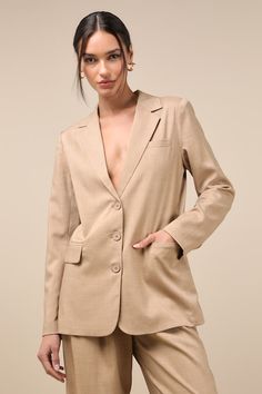 From brunch to the boardroom, prepare for compliments along the way in the Lulus Bold Poise Tan Button-Front Blazer! Lightweight stretch-woven fabric shapes this chic blazer with a collared neckline, notched lapels, and long sleeves with lightly padded shoulders and button cuffs. The slightly oversized bodice features a trio of functional buttons at the center, accompanied by two, functional flap pockets. Kick pleat at back. Pair with the matching pants for a complete look! Fit: This garment fit Tailored Button-up Blazer For Career, Single-breasted Notched Blazer For Office, Chic Business Casual Blazer With Button Closure, Chic Notched Blazer With Button Closure, Chic Career Blazer With Notch Lapel, Beige Button-up Business Blazer, Chic Tailored Button-up Blazer, Single-button Career Blazer For Spring, Notch Lapel Office Chic Blazer