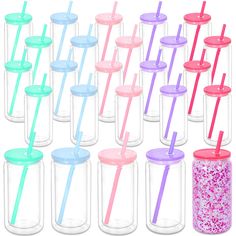 there are many different colored drinking cups with straws in each cup and one is empty