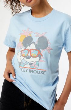 Online only! Who knew that dressing "mousey" could be so cute? Celebrate Walt Disney's most iconic character with these officially licensed Mickey Mouse and Friends styles! All of your favorites, like Mickey Mouse, Minnie Mouse, Goofy, Pluto, Donald Duck, and more, are featured across these adorable Mickey designs that are perfect for your next trip to Disneyland! The Beach Mickey Mouse T-Shirt features a crew neckline, short sleeves, and a front graphic for that classic look.&nbs Mickey Mouse Tops For Disney Trips In Summer, Casual Tops For Disney Trips In Summer, Casual Tops For Summer Disney Trips, Casual Summer Tops For Disney Trips, Casual T-shirt For Disney Fan Events In Summer, Disney T-shirt For Summer Fan Events, Disney T-shirt For Summer Fan Merchandise, Summer Disney Fan Merchandise T-shirt, Summer T-shirt With Cartoon Print For Disney Trips