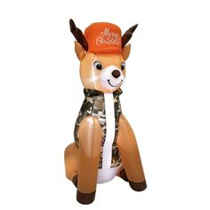 an inflatable deer is sitting on the ground with its hat and scarf around it's neck