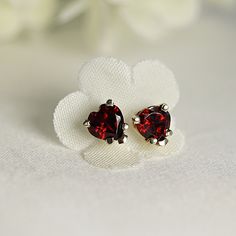 Minimal, modern, heart garnet stud earrings. 14k gold prong setting red gemstone earrings. Great gift for January borns. SOLD AS PAIR. Available white gold or yellow gold from drop down menu. Material; *** 14k solid gold studs *** Heart garnets 5mm *** 5 Prong settings. *** 14k gold backings included. Garnet is the stone that represent symbol of love and friendship. Garnet is January birthstone and 2nd anniversary birthstone. Garnet symbolizes a strong love or romantic connection. It carries the Romantic Connection, Garnet Heart, Red Heart Earrings, Modern Heart, 2nd Anniversary, Heart Stud Earrings, Red Gemstones, January Birthstone, Garnet Earrings