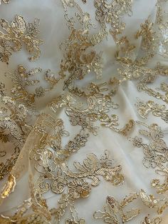 the fabric has gold lace on it