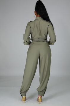 Long sleeve no stretch jumpsuit with collar neck and button closure. The jumpsuit has double pockets and a self tie. 100% polyester Model is wearing a size Small Button Up Jumpsuit, Alisha Berry, Season Change, Water Modeling, Stretch Jumpsuit, Tie Dye Jumpsuit, Collar Neck, Long Sleeve Jumpsuit, Long Jumpsuits