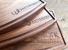 three wooden business cards stacked on top of each other with the words, 40tk advisory