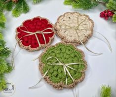 three crocheted coasters tied together with twine