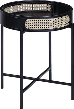 an iron and wicker side table with black metal frame, round tray on top