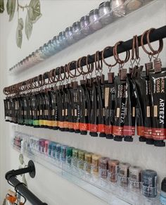 there are many different types of hair products hanging on the wall next to each other