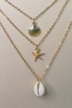 Embrace the beauty of the sea with the Summer Ocean’s Shell Necklace. This enchanting piece features a finely detailed shell pendant, perfect for adding a touch of ocean-inspired elegance to any outfit. Ideal for both casual beach days and sophisticated summer evenings, this necklace brings the serenity of the ocean to your wardrobe. Details Alloy material 14.5” chain , 2” extension extender option and a 1” dainty diffuser extender. Dainty diffuser for diffusing essential oils which can be remov Ocean Inspired Jewelry Gold, Sea Shell Jewellery Holder, Beach Inspired Jewelry, Beach Necklace Aesthetic, Mermaid Jewlery, Beach Jewelry Aesthetic, Beachy Necklaces, Summer Jewlery, Beach Jewelry Diy