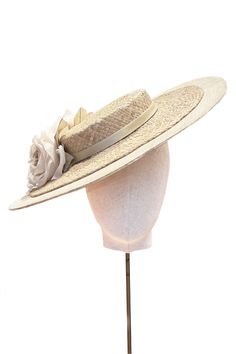 From weddings to the Royal Enclosure at Royal Ascot, the Lovina Boater is a pretty, wearable and timeless style that is light and comfortable to wear.The soft wire headband discretely keeps the hat in place and is effortless to put on, with no risk of ‘hat hair’. A beautiful piece of millinery designed for the Suzannah London collection In collaboration with British milliner, Emily London. Please note that there is a 4 week lead-time from placement of order. --- Base: 100% PinokpokTrim: 100% Sil Tropical Hat, Track Fits, Suzannah London, Knife Pleated Skirt, London Boutique, Ascot Hats, Wire Headband, Hat Hair, Boutique Couture