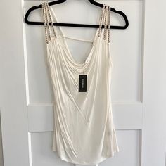 Sleeveless Ivory Top In Sheer Fabric And Gold Beading On Straps. Cowl Neckline. White Sleeveless Camisole For Party, Embellished Camisole Tank Top, Elegant White Tank Top With Straps, Embellished Summer Vest, Elegant White Top With Tank Straps, Embellished Camisole Tank Top For Summer, White Sleeveless Tank Top For Party, White Sleeveless Tank Top For Night Out, White Tank Top With Tank Straps For Night Out