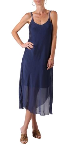 Elegant Midi Silk Dress with Adjustable Spaghetti Straps. Silk Exterior with a Soft Viscose Lining. 30% Silk | 70% Viscose Made in Italy One size fits most. Model is 5'8. Spring Silk V-neck Midi Dress, Elegant Midi-length Rayon Slip Dress, Blue Silk V-neck Maxi Dress, Luxury Midi-length Viscose Slip Dress, Midi Silk Dress, Blue Viscose V-neck Midi Dress, Navy Midi Dress, Silk Dress, Spaghetti Strap