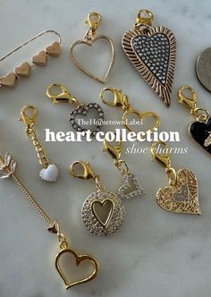 many different types of heart charms on a marble surface with the words heart collection above them