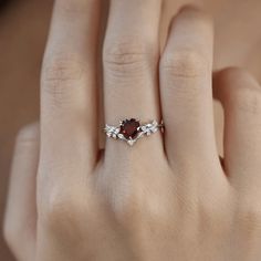 Cue the romance with our stunning Heart’s Desire Red Garnet Ring. This perfect expression of true love features a heart-shaped red garnet center stone along with a curved white topaz leafy band that adds a natural charm. A cherished keepsake that radiates love from every angle. ✦ Available in both 14K white gold vermeil (14K white gold plated over a sterling silver base) and 10K solid white gold. Bff Rings, Red Garnet Ring, Gold Vermeil Jewelry, Vermeil Jewelry, Shop Engagement Rings, Garnet Rings, Engagement Ring Wedding Band, Red Garnet, White Topaz