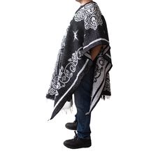 Material: Acrylic WoolColor: BlackStyle: Mexican Design: San JudasSize:Length: 192cm (75")Width: 112 cm (44")It refers to the total measurements of the poncho when it is fully open (like a blanket). Description: MEXICAN PONCHO Genuine Mexican Poncho for Men manufactured in Mexico. The Mexican Poncho is an iconic and versatile garment that has been part of Mexican culture and tradition for centuries. The colorful and artisanal designs of GAMBOA adult ponchos make them a garment that not only expr One Size Black Cape For Festival, Black Cape For Fall Festivals, Black Fall Festival Cape, Black Oversized Outerwear For Festivals, Poncho For Men, Mens Poncho, Alpaca Poncho, Poncho Pullover, Mexican Serapes