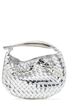 A sardine-inspired sculptural handle brings an artisanal touch to this compact bag crafted of silvery lambskin in the label's signature intrecciato weave. Magnetic closure Top carry handle Unlined Leather Made in Italy Designer Handbags Silver Shoulder Bag With Round Handle For Evening, Luxury Single Handle Shoulder Bag, Chic Silver Shoulder Bag With Round Handle, Modern Silver Shoulder Bag With Round Handle, Modern Silver Bag With Round Handle, Luxury Silver Shoulder Bag With Handles, Designer Silver Shoulder Bag With Handles, Compact Bag, Woman Bags Handbags