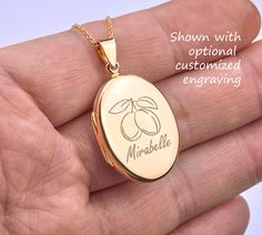 "Custom engraved 14K gold plated over sterling silver oval locket,memorial oval locket,anniversary gift,remembrance photo locket,Valentine's day gift,anniversary gift 1. a large (1 micron) gold plated over sterling silver locket (27 x 20 mm, 5 mm thick, 5.0 grams)     It comes with both sides plain and can be custom-engraved with text or simple graphics.  (please use the pulldown menu to select - \" .... 1 engrv .. \" means 1 side engraved) 2. There are two photo slots inside. Photo insertion service is available (please select the right pulldown option - example \" ... 1 photo\" means/pays for 1 photo inserted by me). If photo service is selected, please send me an ETSY conversation with your photo(s) attached. 3. a 14K gold filled chain closed with a lobster clasp. 4. an optional custom Personalized Oval Link Locket Necklace As Gift, Personalized Oval Link Locket Necklace For Gifts, Gold Oval Jewelry For Personalized Gift, Oval Gold Jewelry For Personalized Gift, Oval Personalized Locket Necklace For Keepsake, Personalized Oval Pendant Locket Necklace, Personalized Oval Locket Necklace For Keepsake, Personalized Rose Gold Oval Pendant Locket Necklace, Engraved Oval Pendant Locket Necklace