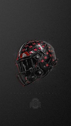 a football helmet with red stars on it is shown in the middle of a black background