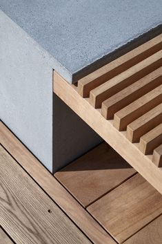 a wooden bench sitting on top of a wooden floor