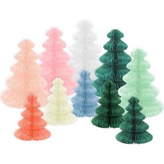 paper christmas trees in different colors on a white background