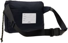 a small black bag with a tag on the front and shoulder strap attached to it