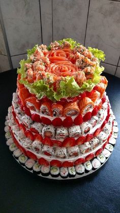 a multi layer cake made out of sushi rolls