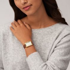 Updated and upscale, this women's Raquel watch from Fossil is a casual choice. 26mm rectangular gold-tone stainless steel case Mother-of-pearl dial and glitz inner frame, date display, Roman numeral markers and mineral crystal Eco-friendly brown LiteHide™ leather band with buckle clasp Water-resistant to 50 meters Fossil Watches Women, Brown Watches, Brown Leather Watch, Watches Women, Fossil Watches, Three Hands, Bracelet Cuir, Brown Leather Strap, Analog Watch