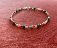 This stunning multicolored handcrafted bracelet is made with vibrant Czech glass beads, natural rice pearl beads and a sterling silver clasp. Each bead is carefully selected and strung by hand on bead thread. The beads are tiny and range from 2mm-4mm. Please select your size from the drop-down menu. Variations will occur due to the nature of the beads and their size and color.  If you have any questions, please feel free to contact us. Let us know if you need a different size than those listed. Thanks for visiting our shop! Multicolor Bracelets With Faceted Oval Beads, Multicolor Faceted Oval Beads Bracelets, Colorful Faceted Beaded Bracelets, Handmade Multicolor Bohemian Pearl Bracelet, Bohemian Handmade Multicolor Pearl Bracelet, Multicolor Beaded Bracelets With Faceted Oval Beads, Multicolor Gemstone Beads Bracelet With Oval Beads, Multicolor Faceted Oval Beads Bracelet, Multicolor Heishi Beaded Bracelets With Faceted Beads