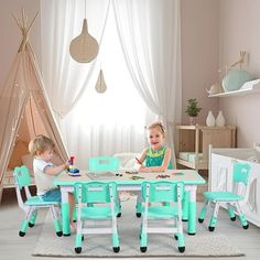 two children sitting at a table with chairs