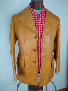 "Eye-catching 1960s/70s vintage Leather coat, minor wear on collar and shoulder (see close-up photos). Very strong durable leather in a beautiful caramel brown. Three inside pockets. Armhole to Armhole across chest 21\" Arm length from shoulder 24\" Jacket length from mid shoulder 31\"" Caramel Leather Jacket, 70s Ideas, Vintage Leather Coat, 70s Fashion Men, Leather Halter Top, Hawaiian Print Dress, Beautiful Word, Crafting Materials, Caramel Brown