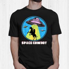 a man wearing a t - shirt that says space cowboy with an alien riding a horse