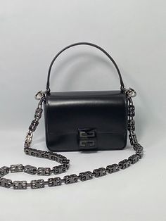 Very good condition with dust bag, light scratches on the surface and scuffs on the chain. Currently selling for $2150 Small 4G bag in Box leather with chain. Crossbody bag in smooth Box calfskin leather 4G line Flap with 4G magnetic metal clasp Medium removable G Cube chain strap Removable handle in leather Givenchy signature embossed on the back Silver-finish metal details One main compartment and one card pocket inside One flat pocket on the back Leather-effect lining 100% calfskin leather Li Cowboy Boot Purse, Yellow Clutch, Givenchy Bag, Chain Crossbody Bag, Bag Light, Chain Bags, Small Bags, Chain Strap, Inside Pocket